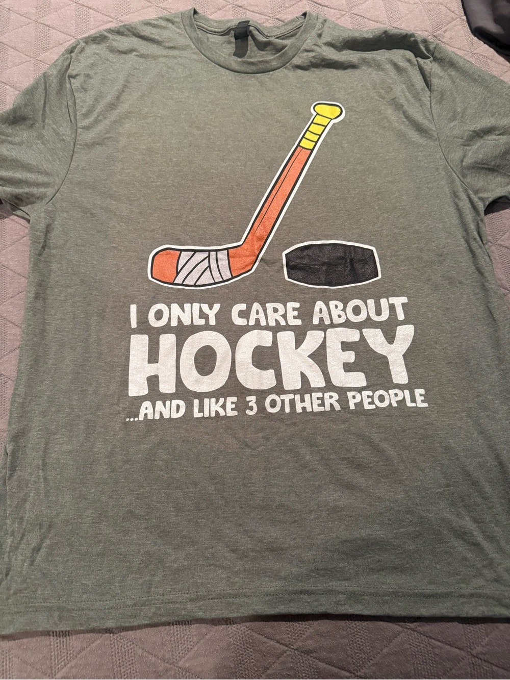 Gildan Olive Green Hockey Graphic Tee with Orange Stick and Yellow Handle